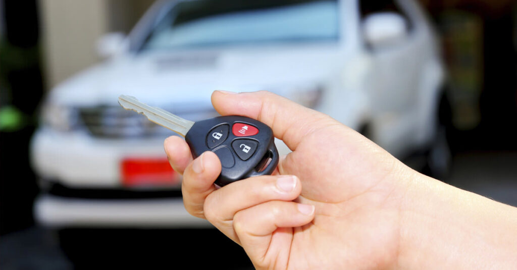 Man checking security system for car