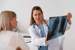 best gout doctor near me analyzing patient's X-ray.