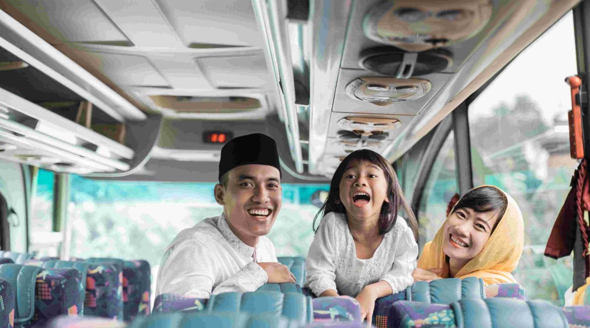 A family that enjoying riding a bus