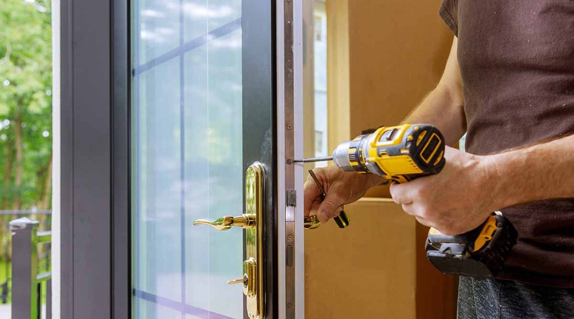 Technician performing patio door repair work